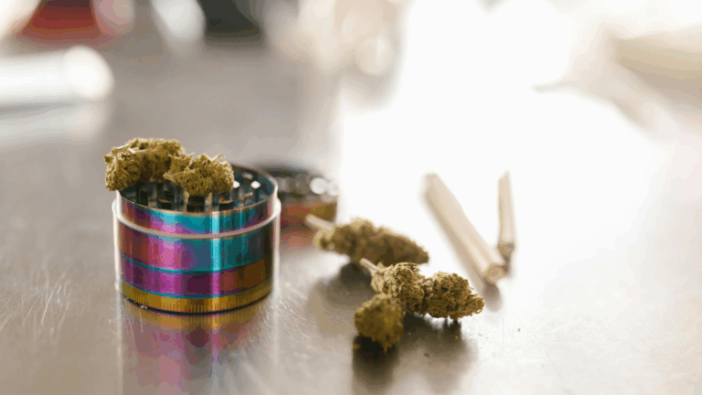 Hemp-derived flower on top of a chrome grimer